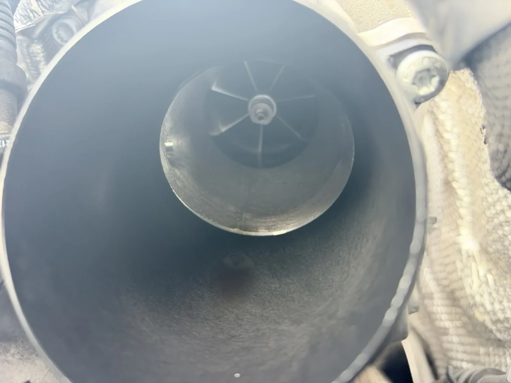 Close-up looking inside the Golf R turbocharger toward the impeller