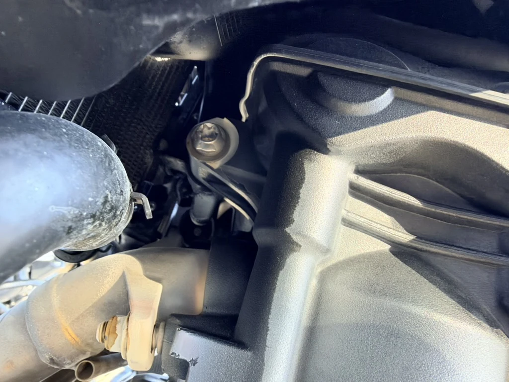 Close-up of the Triumph engine area examined for the compression leak